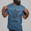 A MYSTERIOUS BEARDED MAN WALKS INTO A ROOM TSHIRT IN STEEL BLUE BLACK MAN SMILING
