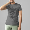 A MYSTERIOUS BEARDED MAN WALKS INTO A ROOM TSHIRT IN ASPHALT WHITE MAN SMILING